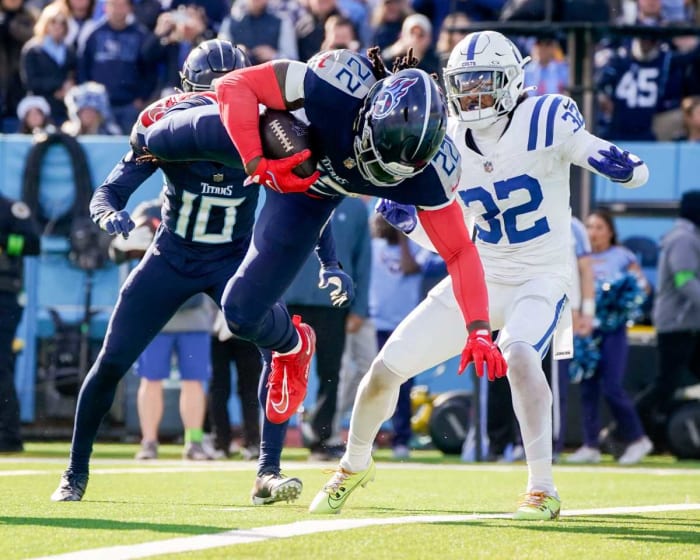 Tennessee Titans running back Derrick Henry (22) leaps for a touchdown against the Indianapolis Colts during the second quarter at Nissan Stadium in Nashville, Tenn., Sunday, Dec. 3, 2023.  